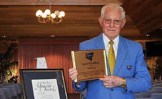 High achiever: Keith Logue with his latest award for services to the funeral industry. High achiever: Keith Logue with his latest award for services to the funeral industry.